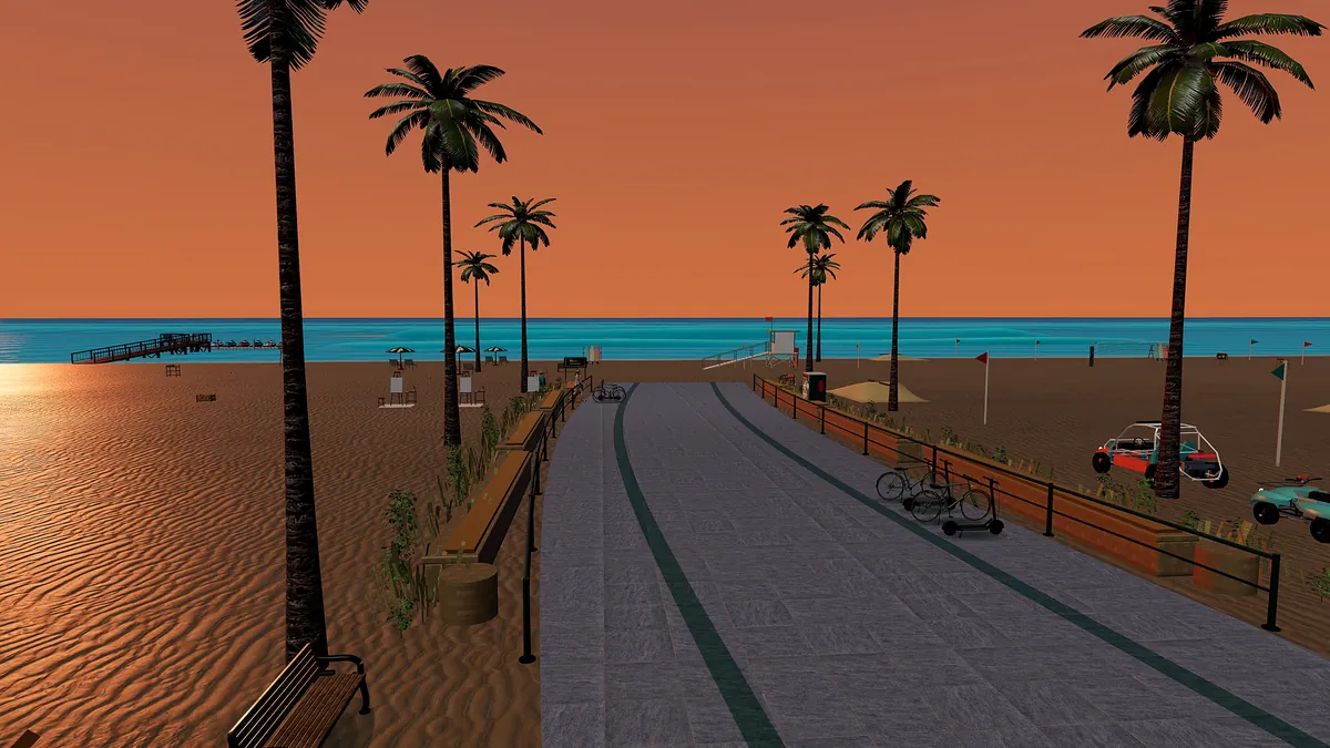 The beach boardwalk in Palm Social at sunset, with palm trees, the pier and the ocean