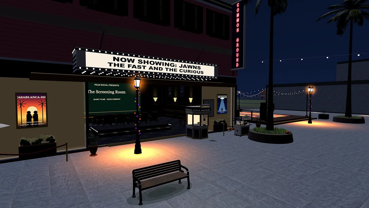 The Palm Social cinema at night, with its marquee lit up